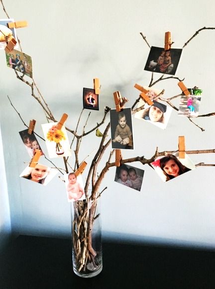 Make a Twig Photo Display - My Bright Ideas Picture Frames Hanging From Trees, Photo Decorating Ideas Party, How To Display Pictures On A Table, Tabletop Photo Display Ideas, Photo Display Ideas For Party, Party Photo Display, Family Photos Outside, Twig Centerpieces, Merch Display