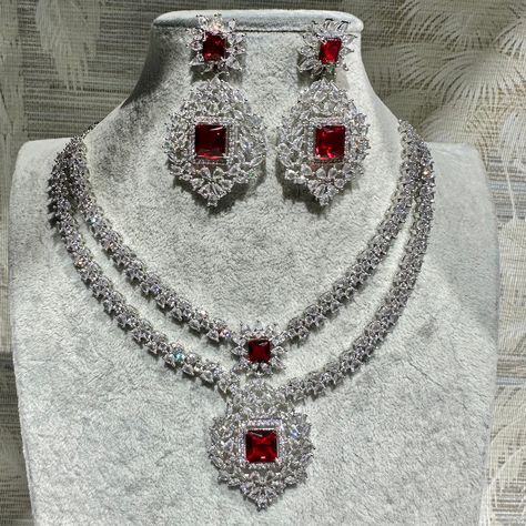 Handmade Style: Necklace and Earrings Set Material: Platinum Plated, Lab Simulated Ruby and White Sapphire Stones Imported Size: Earrings measure 2.25 inches long. Please Note: This necklace and earrings are sold as a set. Item Number: 7079 Layered Diamond Necklace, Ruby Necklace Set, Ruby Pendant Necklace, Platinum Necklace, Ruby And Diamond Necklace, Ruby Necklace Pendant, Fancy Jewelry Necklace, Sapphire Stones, Gold Jewelry Simple Necklace