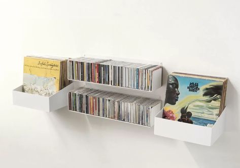 By Reader Request: How To Store CDs Attractively? - Remodelista Music Man Cave, Cd Shelves, Narrow Bookshelf, Floating Books, Home Music Rooms, White Wall Shelves, Cube Storage Shelves, Bibliotheque Design, White Floating Shelves