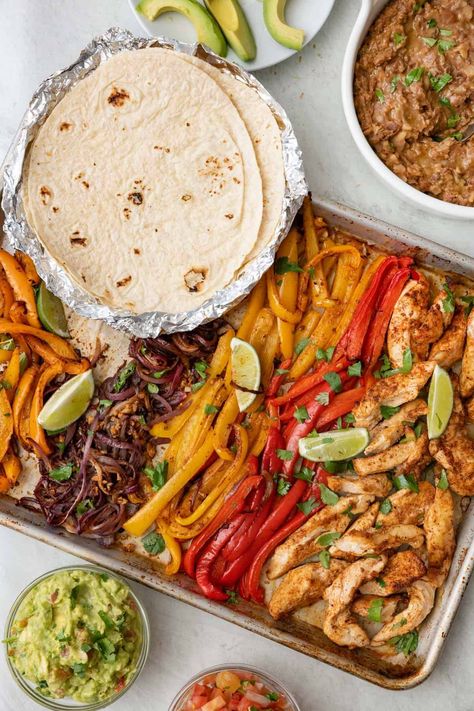 These chicken fajitas are baked in the oven on a sheet pan for a fuss free family meal that is full of flavor. Made with an easy homemade fajita seasoning. Damn Delicious Sheet Pan Chicken Fajitas, Easy Oven Baked Sheet Pan Chicken Fajitas, Lunch Oven Recipes, Fajita For A Crowd, All Food Group Meals, Mexican Tray Bake, Chicken Fajitas Sheet Pan Recipe, Healthy Dinner Meals Families, One Pan Fajitas Chicken