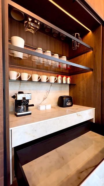 Kitchens of Instagram on Instagram: "If you love coffee and your kitchen countertops clutter free, this is for you! A custom cabinet from @kuchecucina with pocket doors that open to reveal stylish, well-built and well-lit coffee station. . . . . . #kitchendesign #kitchenremodel #kitchenrenovation #kitchendecor #kitchencabinets #kitchenisland #kitchenorganization #kitchenorganizer #kitcheninspo #kitchenware #kitchenset #kitchensofinstagram #kitcheninspiration #kitchenappliances #kitchengoals #kit Kitchen With Built In Coffee Machine, Coffee Machine Cabinet Design, Integrated Coffee Station, Pocket Door Coffee Station, Pivot Pocket Door, Inbuilt Coffee Machine Kitchen, Built In Coffee Station, Coffee Cabinet Station, Bar Pantry