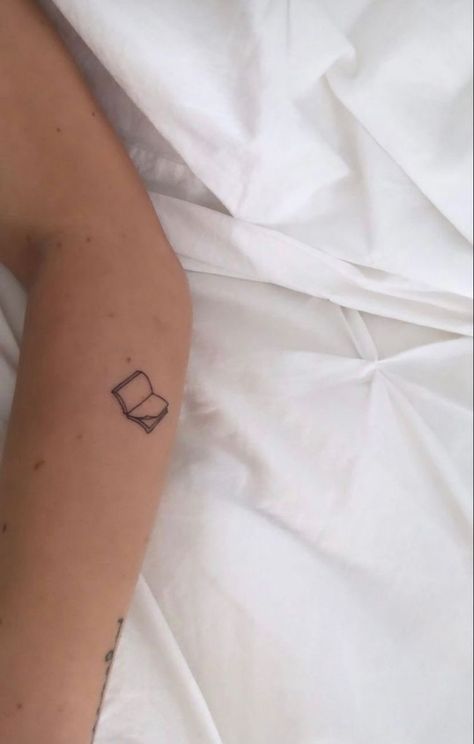 Steph Bohrer Tattoo, Minimal Book Tattoo, Book Tattoos Minimalist, Literature Tattoos Minimalist, Feminist Tattoos Minimalist, Tiny Book Tattoo, Teacher Tattoo Ideas, Milo Tattoo, Notebook Tattoo