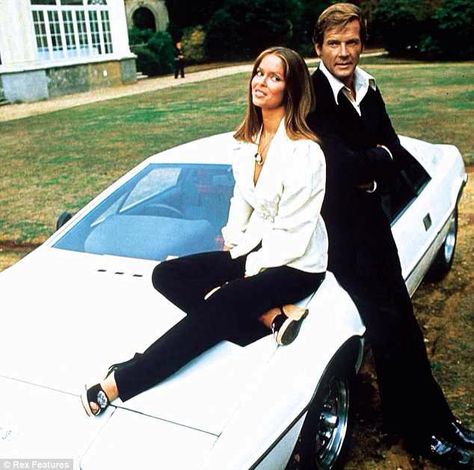 Lotus Esprit with Roger Moore and Barbara Bach from The Spy Who Loved Me. Roger Moore James Bond, 1940s Cars, Cars 1980s, 1980s Cars, Barbara Bach, The Spy Who Loved Me, James Bond Cars, Bond Cars, Spy Who Loved Me