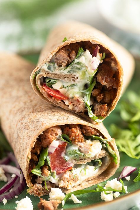 Make these delectable Greek-style lamb wraps! Featuring juicy ground lamb, ripe tomatoes, crisp red onions, and creamy tzatziki sauce, all nestled in soft tortillas. Perfect for a quick lunch or a satisfying dinner. #thefastrecipe #GreekFood #LambWraps #Tzatziki #MediterraneanCuisine #QuickMeal #EasyDinner #DeliciousEats #FoodieFaves #TortillaLove #FreshFlavors #SatisfyingBites #HealthyEating #HomeCooked #GourmetWraps #TastyTreats Lamb Wraps Tzatziki Sauce, Lamb Wraps Recipes, Lamb Sauce Recipes, Lamb Wraps, Ground Lamb Recipes, Soft Tortillas, Lamb Sauce, Leftover Lamb, Smashed Potatoes Recipe