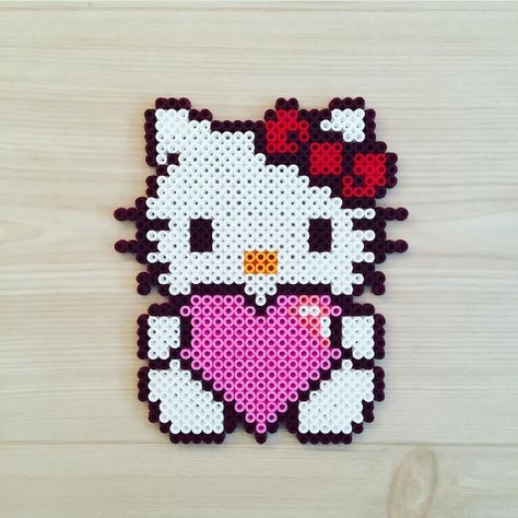 KawaiiBox.com ❤ The Cutest Subscription Box — Get inspired by Kittybeads and make your own Hello... Kitty Perler Beads, Melt Beads Patterns, Hamma Beads Ideas, Easy Perler Beads Ideas, Fuse Bead Patterns, Art Perle, Hama Beads Design, Perler Bead Templates, Diy Perler Bead Crafts