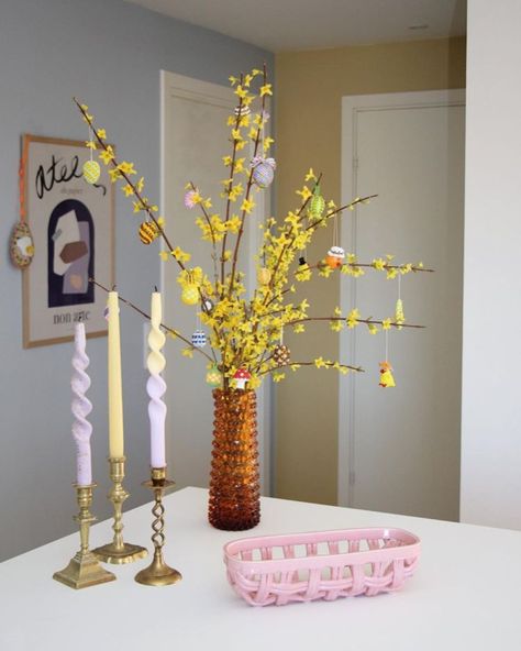 A Danish Home With Easter Touches Danish Living Room, Danish Home, 1970s House, Twisted Candles, My Scandinavian Home, Spring Trees, Pastel House, Spring Tree, Colored Glassware