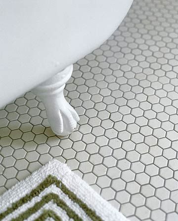 Hexagonal Tile FlooringHexagonal Tile Flooring  For design continuity throughout your home, consider matching flooring or other major elements in all of your bathrooms. In this remodeled bath, the homeowners chose new, unglazed hexagonal mosaic tiles to match those used in the home's other baths. White Hexagon Bathroom, Hexagon Bathroom Floor, Victorian Flooring, Hexagon Bathroom, Honeycomb Tile, Hex Tile, Hexagon Mosaic Tile, Victorian Interior, Mosaic Floor