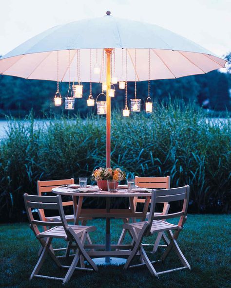 Whether your goal is to lounge, entertain, dine, or simply escape -- we have ideas to create your ideal outdoor space. Personalize your patio, porch, or other alfresco room to suit your seasonal pursuits. Outdoor Umbrella Lights, Umbrella With Lights, Diy Patio Ideas, Patio Umbrella Lights, Patio Table Decor, Best Patio Umbrella, Backyard Dining, Diy Outdoor Lighting, Outdoor Party Lighting