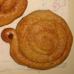 Cinnamon Snails Cinnamon Snails Recipe, Cinnamon Snails, Spring Dessert Recipes, Confectioners Sugar Glaze, Snails Recipe, Spritz Cookie, Spring Dessert, Cinnamon Cookies, Spritz Cookies