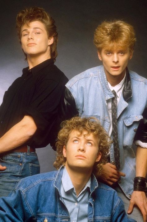 The Norwegian pop trio a-ha are Paul Waaktaar-Savoy (guitars), Magne Furuholmen (keyboards and guitars), and Morten Harket (vocals). L-R: Harket, Furuholmen, Waaktaar-Savoy A Ha 80s, 80s Men Fashion, Teen Posters, Aha Band, 80s Men, 80s Pop, One Hit Wonder, A Ha, 80s Bands