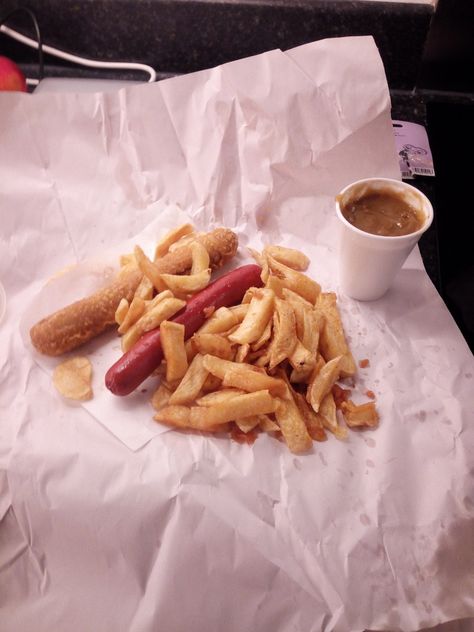 Saveloy, battered sausage, chips and curry sauce. Fries And Sausage, Sausage Poboy, Sausage And Chips, Crispy Sausage, Battered Sausage, Rope Sausage, Curry Sauce, Sauce, Chips