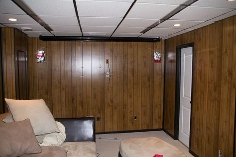 Wood paneled walls in basement Panel Wall Remodel, Remodel Wood Panel Walls, Paneled Basement Makeover, Panel Basement Makeover, Covering Paneled Walls, Wallpaper Basement Walls, How To Cover Wood Panel Walls, Wood Panel Bedroom Ideas, Wallpaper On Paneled Walls