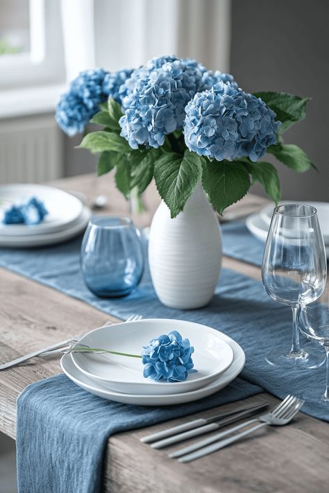 Elevate your gatherings with stunning blue and white tablescapes that blend casual charm with elegant style. Perfect for weddings, dinners, or any event, these table settings bring a timeless touch to every occasion. From delicate patterns to bold accents, find inspiration to create a look that's both classic and memorable. Impress your guests with a design that’s as inviting as it is beautiful! Picnic Basket Centerpiece, Blue Tablescapes, Blue And White Tablescapes, Wildflower Centerpieces, White Floral Centerpieces, Intimate Dinner Party, Bamboo Flatware, White Linen Napkins, Gingham Tablecloth