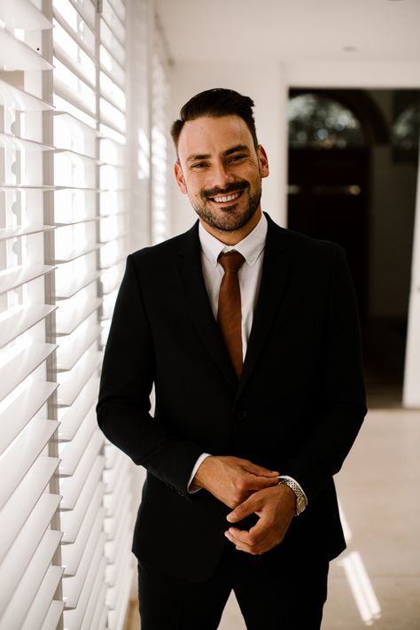 This groom looked classic in a black suit + burnt orange tie | Image by Thunder & Love Wedding Photography Sushi Wedding, White And Gold Color Palette, Groom Attire Black, Grooms Outfit, Macrame Arch, South Africa Wedding, Rusting Wedding, Grooms Suit, Africa Wedding