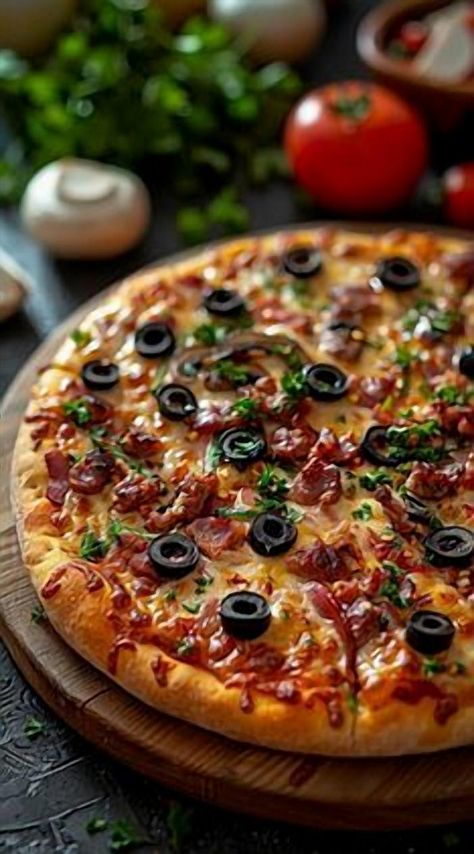 Indulge in the ultimate comfort food experience with this mouthwatering homemade pizza recipe. Perfectly crispy crust topped with a savory blend of olives and crispy bacon, this pizza is a delightful fusion of flavors that will have your taste buds dancing. Whether you're hosting a cozy dinner night or simply craving a slice of heaven, this recipe is sure to impress. Easy to make and utterly delicious, it's the perfect way to bring everyone together around the table. Recipe With Olives, Olive Pizza, Pizza Photography, Food Polls, Homemade Pizza Recipe, Pre Made Meals, Creative Pizza, Neapolitan Pizza, Olive Recipes