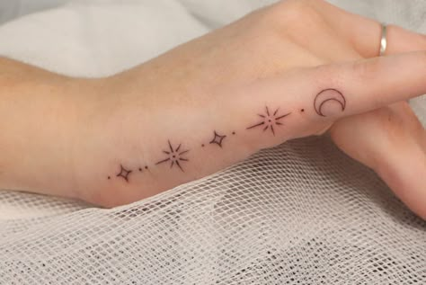 Crescent Moon Tattoo On Finger, Crescent Moon Stars Tattoo, Moon Star Finger Tattoo, Delicate Celestial Tattoo, Small Moon And Stars Tattoos For Women, Celestial Finger Tattoos For Women, Moon And Star Finger Tattoo, Mystical Moon Tattoo, Moon Finger Tattoos For Women