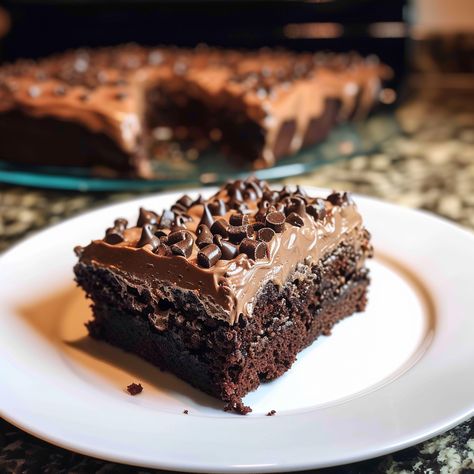 Baileys Chocolate Poke Cake is a decadent dessert that infuses the rich flavor of chocolate cake with the creamy, boozy kick of Baileys Irish Cream. The method of poking holes in the cake and drenching it with a Baileys and sweetened condensed milk mixture ensures every bite is moist and flavorful. Topped with hot fudge...Read More Baileys Chocolate Sheet Cake, Chocolate Irish Cream Cake, Baileys Poke Cake Recipe, Baileys Chocolate Poke Cake, Bailey Chocolate Cake, Irish Cream Chocolate Cake, Baileys Irish Cream Cake, Irish Cream Cake, Irish Chocolate