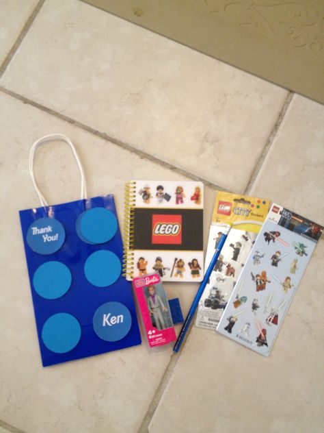 Favor bags for boys. Lego notepad, stickers, and Ken figure(all from toys r us). Lego pencil and eraser from Barnes and noble Barbie Boy Favors, Ken Party Favors, Barbie Party Favors For Boys, Barbie Bday, Pencil And Eraser, Birthday Barbie, Boy Party Favors, 5th Birthday Party Ideas, Birthday Goodie Bags