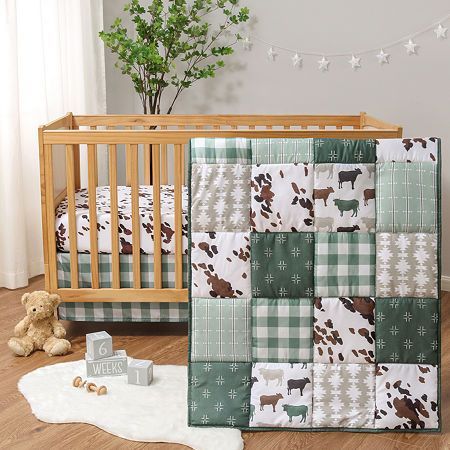 Home is where the herd is thanks to the boho farm 3-piece bedding set by the peanutshell. This collection features a classic cow print and rich forest green patchwork that seamlessly blend modern farmhouse with traditional elements. The set includes a standard fitted crib sheet with strong elastic, a 32" x 41" quilt, and a traditional check crib skirt for a tailored finish. The charming collection brings a touch of contemporary rustic to your nursery. For easy care, wash on a cold, gentle cycle Farm Nursery Theme, Farmhouse Bedding Sets, Cow Nursery, Crib Comforter, Modern Bed Set, Baby Crib Bedding Sets, Baby Crib Sheets, Baby Crib Bedding, Farmhouse Bedding