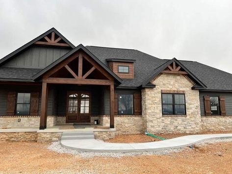 Dark Home Exterior Farmhouse, Austin Homes Exterior, Montana Home Exterior, Modern Mountain Ranch Home Exterior, Farmhouse With Rock Exterior, Rock And Brick Exterior Homes, Trendy Home Exterior, Barndo With Stone, Grey House Wood Accents