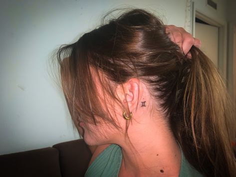 Behind Ear Tattoo Gemini, Initial Tattoo On Back Of Neck, Pisces Symbol Tattoo Behind Ear, Zodiac Behind Ear Tattoo, Gemini Tattoo Behind The Ear, Small Gemini Tattoo For Women Behind Ear, Pisces Ear Tattoo, Peace Sign Tattoo Behind Ear, Gemini Ear Tattoo