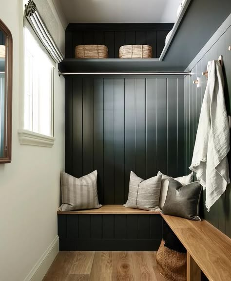 An l-shaped wood top mudroom bench is fixed against a black shiplap backsplash under a tension rod and brass hooks fixed under an l-shaped black shelf. Cottage Laundry Room, Waterfront Cabins, Laundry Room Ideas Small Space, Mudroom Bench Seat, Lake Winnipesaukee, Lake Cabin, Herringbone Floor, Laundry Room Diy, Small Laundry Rooms