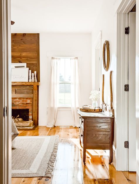 Behr Bit of Sugar is the perfect white paint color! With no yellow undertones, it's a true bright cool-toned white, but it's also not stark white. Our farmhouse has a lot of warm wood tones throughout with our pine floors, and darker reclaimed wood shiplap throughout. The warmth of the wood and the warmth from our home's furnishings pair really well with the bright white of Bit of Sugar. Head to the post for more details and more photos of Bit of Sugar in our farmhouse! White Paint White Trim, Behr Bit Of Sugar, Perfect White Paint, White Paint Color, Pine Wood Flooring, Stained Trim, Dark Trim, New Paint Colors, Best White Paint