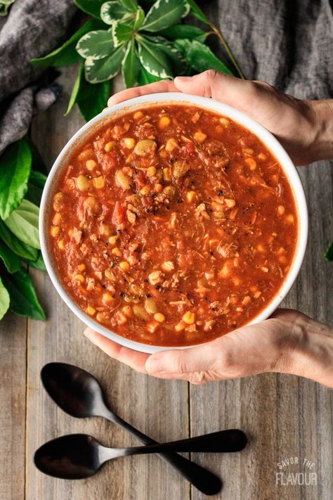 Georgia Brunswick Stew: tasty Southern recipes can bring families together by enjoying homemade cooking at weeknight dinners, and this Brunswick stew recipe is no exception. Pulled pork, chicken, tomatoes, and other veggies simmer together in this country comfort food. | www.savortheflavour.com #brunswickstew #southernfood #comfortfood #recipes #souprecipe Brunswick Stew Recipe Georgia, Best Brunswick Stew Recipe, Brunswick Stew Recipe, Chicken Tomatoes, Brunswick Stew, Pork Chicken, Southern Dishes, Homemade Cooking, Soup And Stew