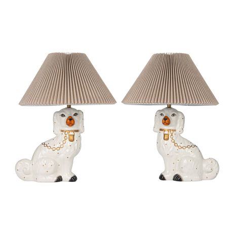 This hand-painted ceramic vintage reproduction Staffordshire table lamp features a dog-shaped base, inspired by 18th and 19th-century Staffordshire pottery. The base is multi-colored, adding variety and texture to the decor. The pleated fabric shade complements the base, diffusing light from a 60-watt bulb for a soft, warm glow. The white shade adds brightness and contrast to the space. The lamp has an inline switch for easy control. Made of ceramic and cotton, it measures 13 inches in diameter Teak Interior, Dog Lamp, Staffordshire Pottery, Dog Table, Classic Table Lamp, Grand Millennial, Ceramic Vintage, Staffordshire Dog, Table Lamp Sets