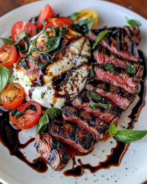 BALSAMIC GRILLED FLANK STEAK CAPRESE 🥩🍅🍃 Ingredients: 1.5 lb flank steak Salt and black pepper, to taste 1/4 cup balsamic vinegar 1/4 cup olive oil 2 cloves garlic, minced 1 tsp dried oregano 1 tsp dried basil 4 large tomatoes, sliced 8 oz fresh mozzarella, sliced Fresh basil leaves Balsamic glaze (optional, for drizzling) Directions: Step 1: Marinate the Steak In a bowl, whisk together balsamic vinegar, olive oil, minced garlic, dried oregano, dried basil, salt, and... Balsamic Flank Steak Caprese, Grilled Flank Steak Caprese With Balsamic, Grilled Flank Steak Caprese, Flank Steak Caprese, Steak Caprese, Balsamic Flank Steak, Healthy Steak Recipes, Gourmet Steak, Balsamic Glaze Recipes