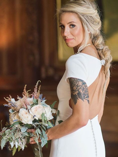 Embrace your tattoo on your wedding day. Here are real brides who showed off their ink on their special day. Back Tattoo Wedding Dress, Tattoo With Wedding Dress, Wedding Dress Tattoos Brides, Tattoo Wedding Dress, Fishtail Dresses, Tattooed Bride, Tattoo Wedding, Wedding Dress Backs, Wedding Dresses Images