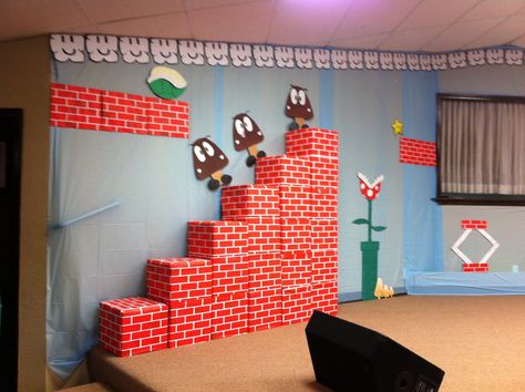 Mario VBS Mario Themed Backdrop, Super Mario Vbs, Mario Vbs Decorations, Mario Vbs, Mario Castle, Orange Vbs, Power Up Vbs, Mario Kart Party, Mario Bros Birthday Party Ideas