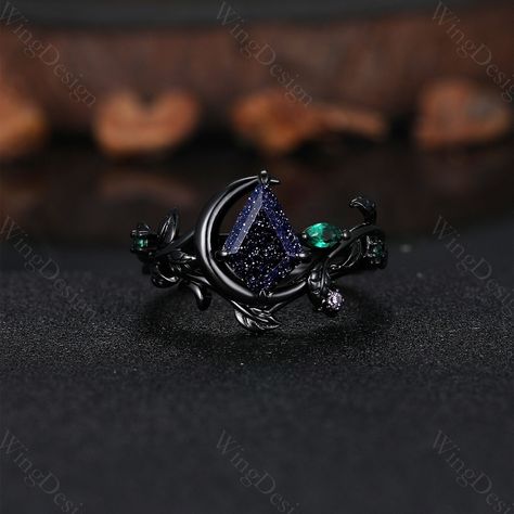 Nature inspired blue sandstone engagement ring set unique moon style emerald cluster ring gothic black gold rings for women leaf branch rings -----Ring Information----- ✦Engagement Ring Metal Type: 925 sterling silver, 10K/14K/18K Solid Gold, Platinum Center stone: Blue sandstone Stone size: 7x10mm kite cut Side stone: emerald ✦Wedding Band Stone: Round amethyst  ✦ Please feel free to contact me if you have any questions or you are interested in custom order. ✦Black rhodium plating: Rhodium, a v Sapphire And Garnet Ring, Black Gold Wedding Rings Sets, Moon Engagement Ring Silver, Bismuth Engagement Ring, Simple Black Engagement Rings, Blue Sandstone Engagement Ring Silver, Gothic Engagement Ring Silver, Engagement Rings Gothic, Witch Wedding Ring