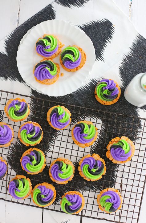 Pumpkin Sugar Cookies topped with Buttercream Swirl Frosting are my new favorite treat to serve up every Halloween! #halloween #halloweencookies #pumpkin #pumpkincookies #halloweenrecipes Swirl Frosting, Swirl Cookies, Black Frosting, Purple Food Coloring, Pumpkin Sugar Cookies, Black Food Coloring, Orange Food Coloring, Purple Food, Halloween Color