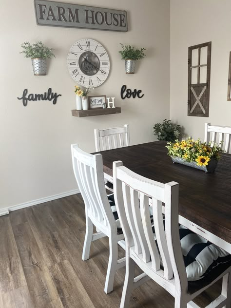 All wood White Santa table with 6 chairs. Farmhouse wall decor. Sunflower centerpiece arrangment. Black and white stripe seat cusions. Over Kitchen Table Wall Decor, Wall Decor In Kitchen Ideas, Kitchen Wall Decor Ideas Behind Table, Kitchen Wall Decor By Table, Dinning Room Farmstyle, Wall Decor For Dining Area, Black And White Kitchen Wall Decor, Black White And Grey Kitchen Decor Ideas, Small Dining Wall Decor Ideas