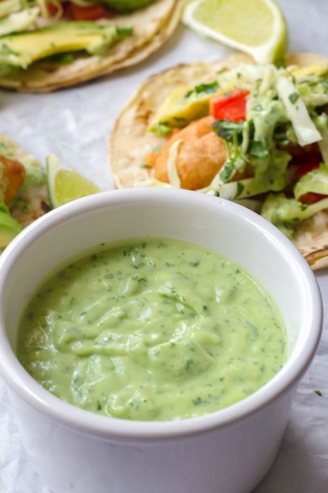 Avocado Crema! Smooth and silky, and super quick and easy to make. Use it on tacos or as a sandwich spread #avocadocrema #avocado #avocadosauce #easy #quick | cookingformysoul.com Fish Tacos With Avocado Crema, Easy Beer Batter, Chipotle Lime Crema, Fish Tacos With Cabbage Slaw, Avocado Lime Crema, Fish Tacos With Avocado, Avocado Lime Sauce, Tacos With Cabbage Slaw, Fish Tacos With Cabbage