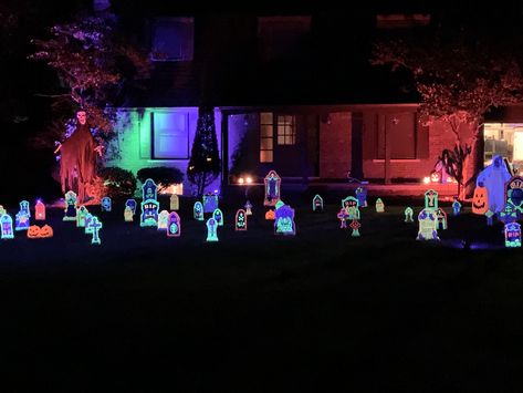 This black light graveyard using neon paints, a few black light spot lights and accent lighting makes a fun, unique Halloween display. Halloween Blacklight, Black Light Halloween, Annie Lol, Neon Graveyard, Light Halloween, Neon Painting, Spot Lights, Halloween Outdoor, Halloween Displays