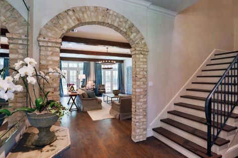 This entry is perfection! Brick arch anyone?! #Inspiration  #GreenBasementsandRemodeling #Brick #BrickArch #Entry #RoswellRemodel #AlpharettaRemodel #AtlantaRemodel #WoodstockRemodel #AtlantaConstruction Tile Archway, Arch Kitchen, Archways In Homes, Brick Arches, Arch Entryway, Brick Archway, Stone Archway, Brick Accent Walls, Interior Brick