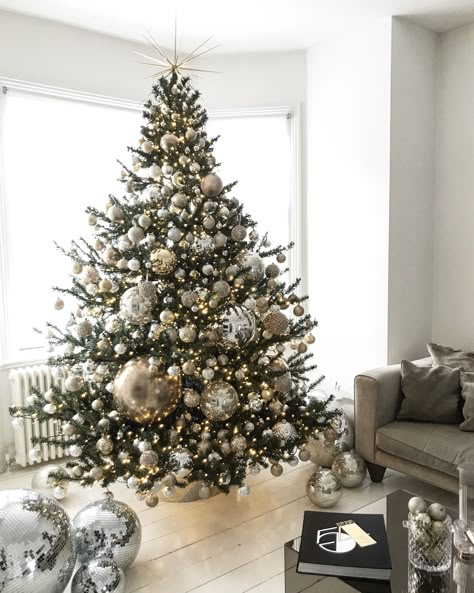 My Christmas Tree for 2018, decorated with mixed gold and silver baubles to reference the iconic Studio 54 logo. The tree topper is a recreation of when a spotlight hits a disco ball. Christmas Tree Inspiration Simple, Christmas Tree Inspo, Gold Christmas Tree Decorations, Silver Christmas Decorations, Modern Christmas Tree, Elegant Christmas Trees, Modern Christmas Decor, Silver Christmas Tree, Real Christmas Tree