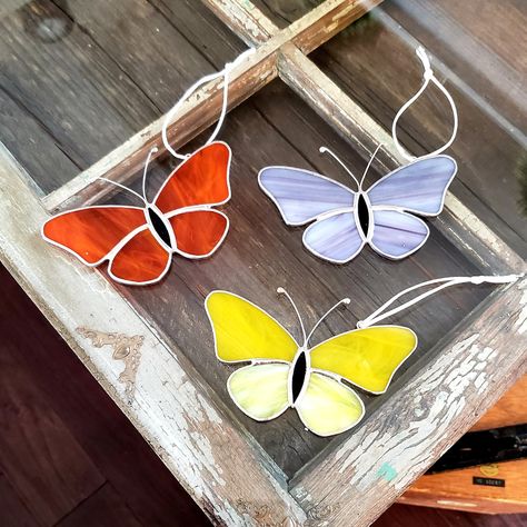 These stained glass butterfly sun-catchers are made in my home studio using beautifully colored stained glass. They look amazing in a window, hanging on a wall or suspended from the ceiling or out in the garden where the light can shine through. Perfect for the butterfly lover, or anyone who enjoys nature. Sold individually. It measures approx 5" x 2.5" Strung with white silky rattail cord so it can be hung immediately.  Polished to a brilliant shine and packaged with extra care to ensure safe t Stained Glass Butterfly Pattern, Bird Stained Glass Patterns, Butterfly Stained Glass Pattern, Butterfly Stained Glass, Glass Butterflies, Diy Stained Glass Window, Butterfly Suncatcher, Simple Butterfly, Stained Glass Butterfly