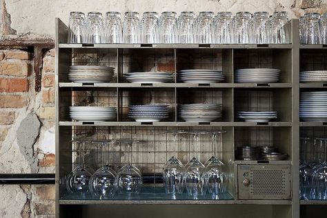 Interior of Restaurant La Soupe Populaire in Berlin, Remodelista. Above: An idea to borrow at home—plates and glassware stacked in a vintage metal office rack Waiter Station, Restaurant Shelving, Outdoor Restaurant Design, Warehouse Shelving, Industrial Style Kitchen, Stainless Kitchen, Plate Storage, Vintage Industrial Decor, Living Room Decor Inspiration