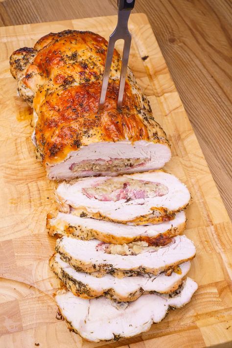 Try this show-stopping rolled turkey breast with sage and onion stuffing for your next holiday meal! Butterflied boneless turkey breast, layered with smoky bacon and stuffing before being rolled and smothered in garlic herb butter, this stuffed turkey breast is full of flavour and easy to slice. Perfect for Christmas dinner! #TurkeyRecipe #StuffedTurkey #HolidayDinner #TurkeyRoulade Turkey Roulade With Stuffing, Turkey Breast Rolled With Stuffing, Turkey Roll Ups With Stuffing, Turkey Breast With Stuffing, Rolled Turkey Breast, Rolled Turkey, Stuffed Turkey Breast, Onion Stuffing, Turkey Roulade