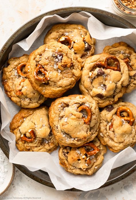 Overhead photo of nine kitchen sink cookies piled into a parchment paper-lined antique pan. Kitchen Sink Cookie Recipe, Cookies With Pretzels, Freezable Cookies, Kitchen Sink Cookies Recipe, Cookie Sheet Pan, Sink Cookies, Kitchen Sink Cookies, Pretzel Cookies, Everything But The Kitchen Sink