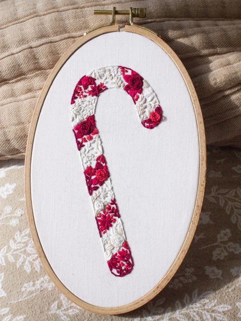 Happy Holidays!! Are you looking for a classic Christmas Embroidery pattern with a bit of a twist? Look no further then this whimsical and vibrant Candy Cane Blooms pattern! This creative and innovative design utilizes tiny blooms and leaves to fill in the candy cane stripes giving the effect of a fully filled candy cane artwork. This is the perfect festive project to work away over the holiday season and hang proudly as christmas decor or to gift to your favourite floral lover! Candy Cane Embroidery, Candy Embroidery, Embroidery Sweater, Christmas Embroidery Patterns, Xmas Sweater, Candy Cane Stripes, Embroidery Christmas, Christmas Embroidery, Embroidery And Stitching