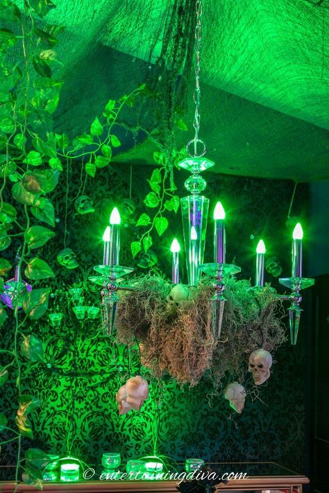 These Maleficent party decor ideas are awesome! From the enchanted forest to the lighting to the Maleficent cake, they would make an awesome Halloween party theme! #entertainingdiva #halloween #maleficentparty #halloweenindoordecor #halloweenscenesetters  #halloweenpartyideas Halloween Scene Setters, Maleficent Cake, Halloween Candy Buffet, Halloween Decorations Outdoor Porch, Maleficent Party, Green Christmas Lights, Party Decor Ideas, Witch Party, Forest Party