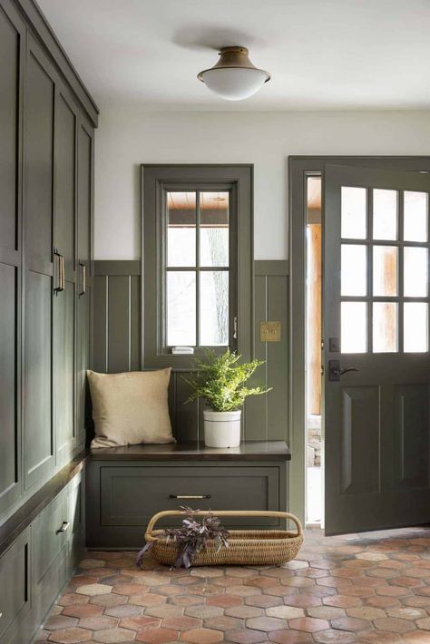 Inside a warm and inviting Minnesota lake house remodel on a woodsy setting Green Cabinet Mudroom, New England Mudroom, Woodsy Home Interior, Green Mud Room Ideas, Mudroom Door Interior, Grandpa House Aesthetic, English Country Mudroom, Woodsy Cottage Interior, Lake House Flooring