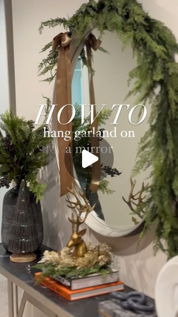 Katelyn DeHart on Instagram: "How to hang garland on a mirror… ⁣
⁣
It’s a really simple and quick way to dress up your home for the holidays! You just add command hooks to the sides of your mirror after dusting, lay the garland on and wire it to the hooks and you’re done! I zip tied a second garland on top as well and topped it off with a long bow. ⁣
⁣
Comment GARLAND for links to everything you need to complete this look. ⁣
#dehartdesigns #garland #garlandmirror #mirrorgarland #christmasdecor #christmasdecorating" Mirror Garland Decor, Christmas Garland On Mirror, Christmas Swag Over Mirror, Garland Over Mirror, Garland Around Mirror, Garland On Mirror, Mirror Garland, How To Hang Garland On Mantel, Christmas Garland Diy