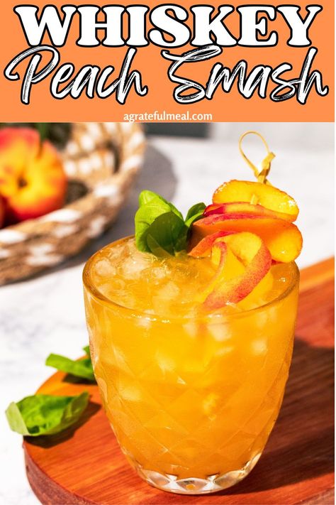 This whiskey smash is made with muddled peaches and basil to make one of the most delicious summer cocktails. Sweet and tart with a kick of bourbon whiskey, it's bound to be your new favorite cocktail. Drinks With Bourbon Whiskey, Bourbon Peach Smash, Peach Whiskey Cocktails, Summer Bourbon Cocktails, Peach Bourbon, Peach Whiskey, Whiskey Smash, Yummy Summer Cocktails, Bourbon Smash