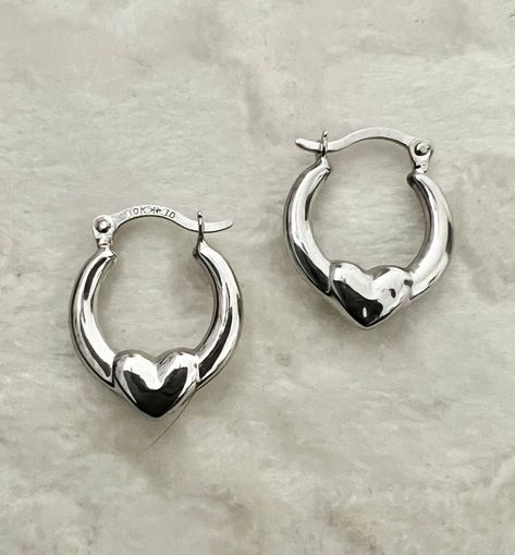 Description: Elevate your style with our 10K Real White Gold Heart Huggie Hoop Earrings, featuring a modern twist with delicate beads for added texture and dimension. These minimalist 15mm/.60" hoops are both polished and satin-finished, striking a perfect balance between classic and contemporary. Lightweight and comfortable, they are ideal for everyday wear and special occasions. Crafted from high-quality 10K white gold, these Heart Huggie Hoop Earrings add a touch of luxury to any jewelry collection. The small, delicate design ensures versatility, making them perfect for any outfit. Their timeless elegance makes these earrings a cherished accessory for any style-conscious individual. Product Specification: ------------------------------- • Metal: 10K Gold • Finish: Polished and Satin • S Earring Hoop, Heart Hoop Earrings, Classic Earrings, Dope Jewelry, Gold Satin, Funky Jewelry, Jewelry Lookbook, White Gold Jewelry, White Gold Earrings