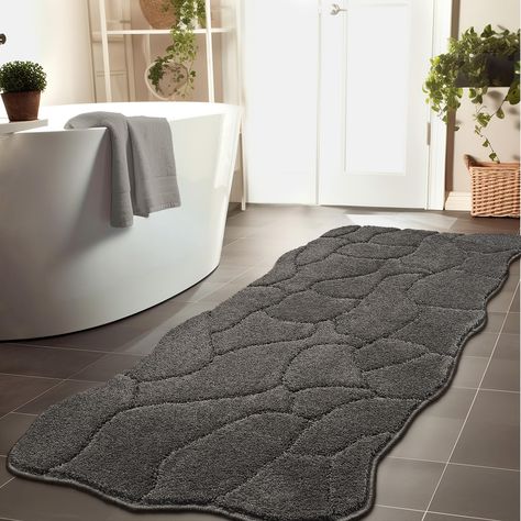 PRICES MAY VARY. 【UNIQUE WAVE DESIGN BATH MAT】: Bsicpro bathroom rug designed with wave edges, compared to the regular rectangle rugs on market, our irregular and dynamic shape bath mat have a more decoratirve styles. Combined with the ups and downs wave texture microfiber, making the bath rug more fashionable and experiential. It is a perfect choice to embellish your bedroom living and home decor. 【PATENTED NON-SLIP BATHROOM RUGS 】: The shower mat is made of patented anti- slip backing with hig